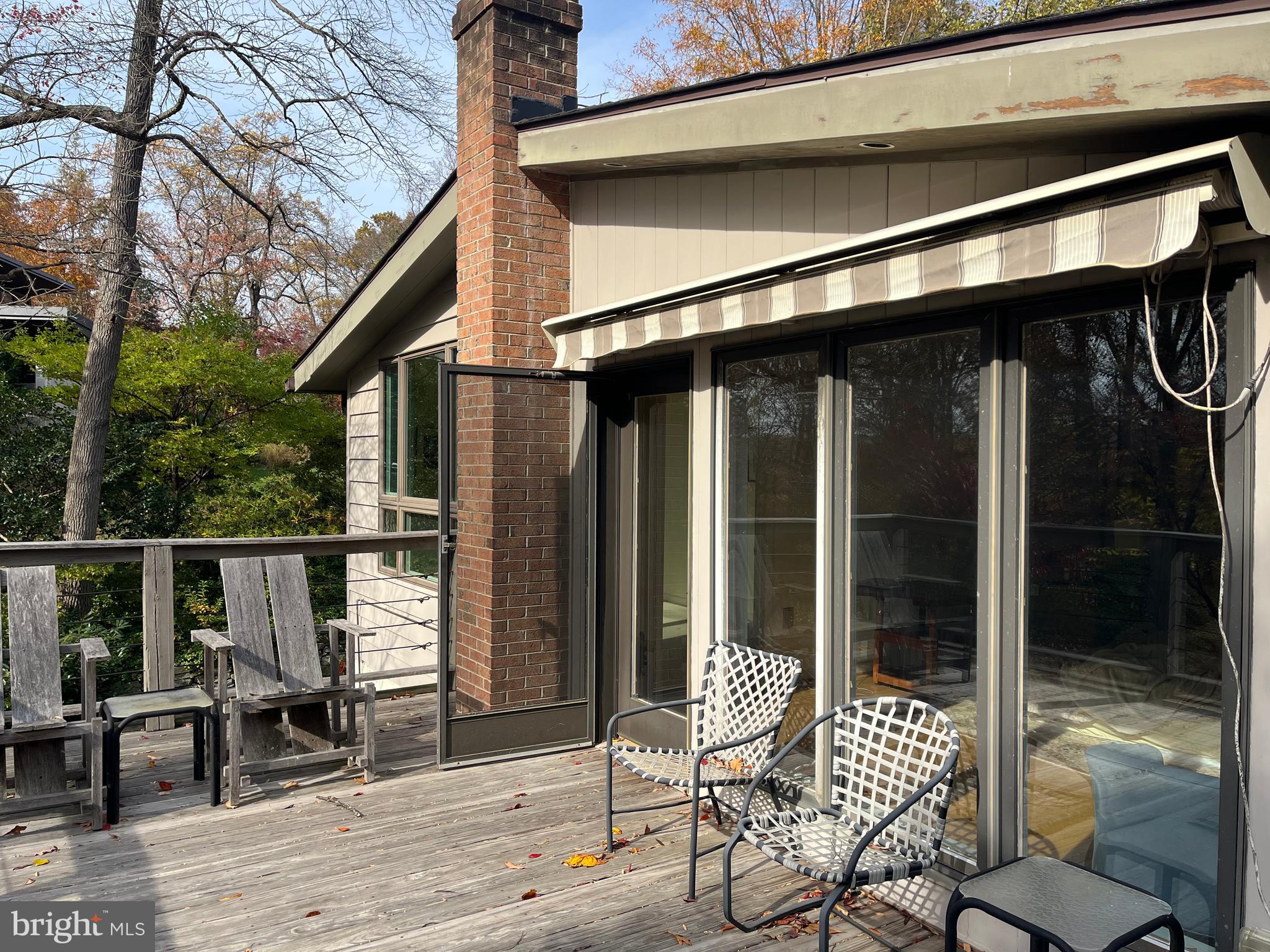5651 Bent Branch Road Bethesda, MD 20816 - Photo 6 of 16 a patio with table and chairs and potted plants