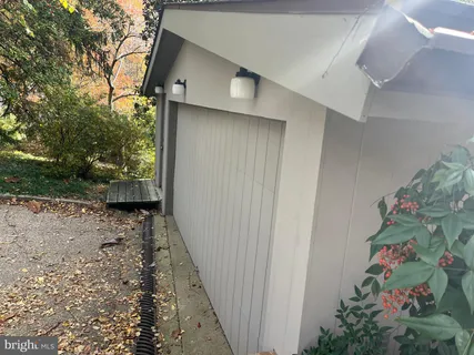 a view of a house with a tree