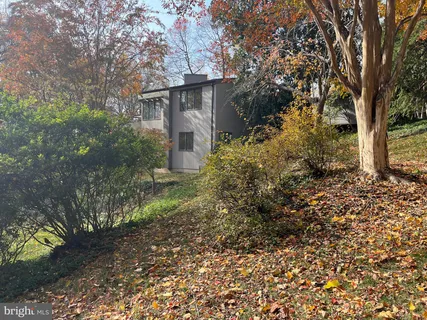 a view of a balcony with flower plants