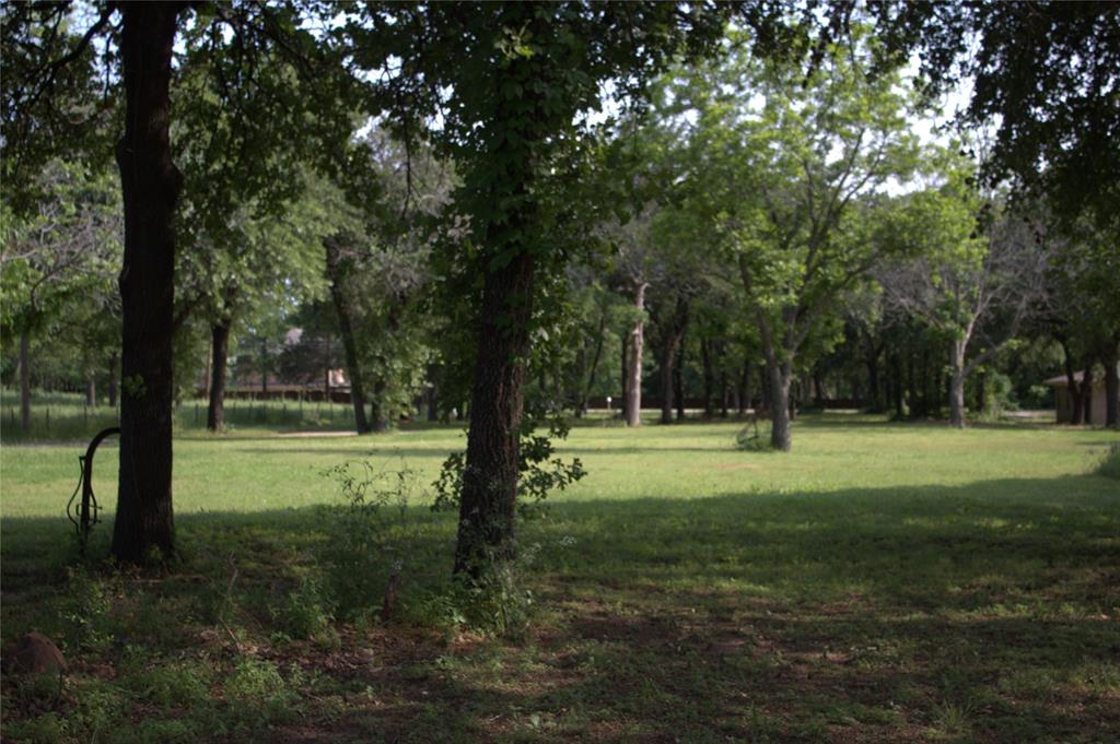 1925 Florence Road Keller, TX 76262 - Photo 11 of 14 a view of field with trees in the background