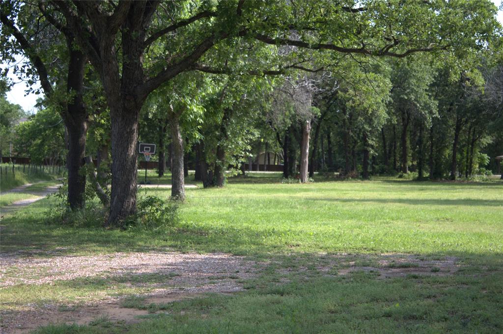 1925 Florence Road Keller, TX 76262 - Photo 9 of 14 a backyard of a house with lots of green space
