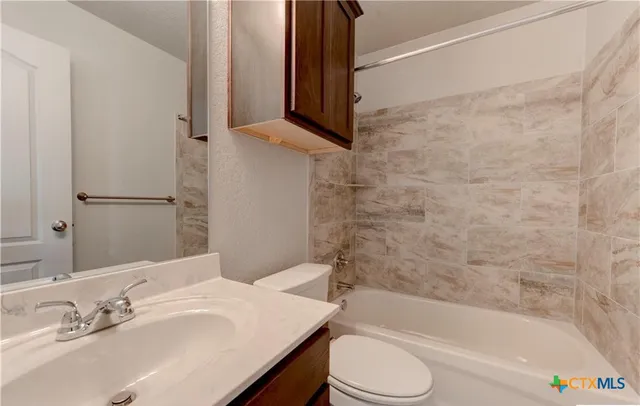 a bathroom with a sink and a bathtub