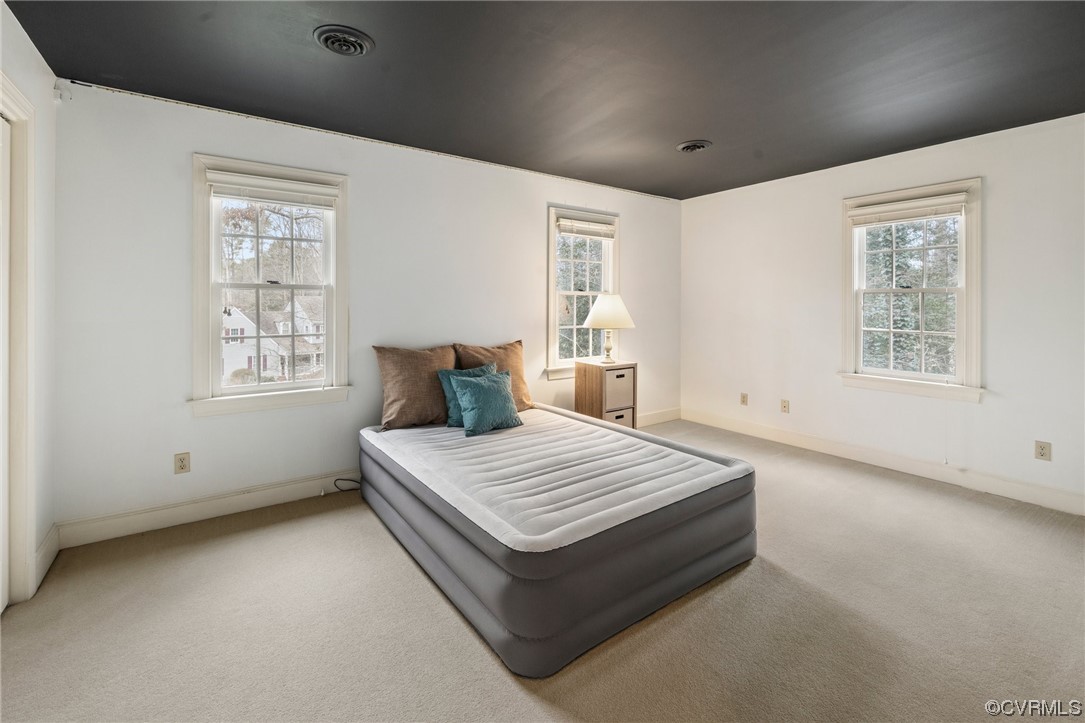 8920 Cardiff Road North Chesterfield, VA 23236 - Photo 31 of 36 a spacious bedroom with a bed and window