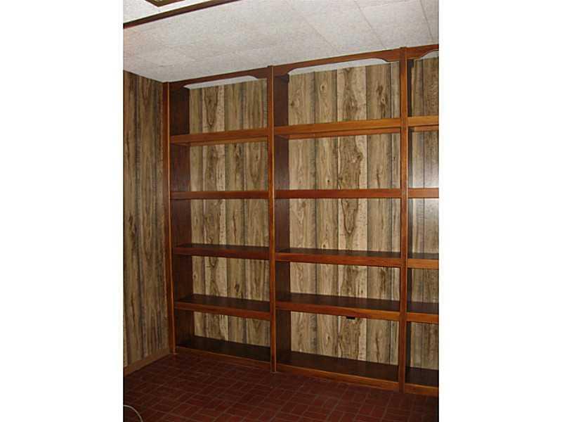 1825 Cowling Road Scottdale, PA 15683 - Photo 18 of 19 Family Room. Lots of shelving for storage.