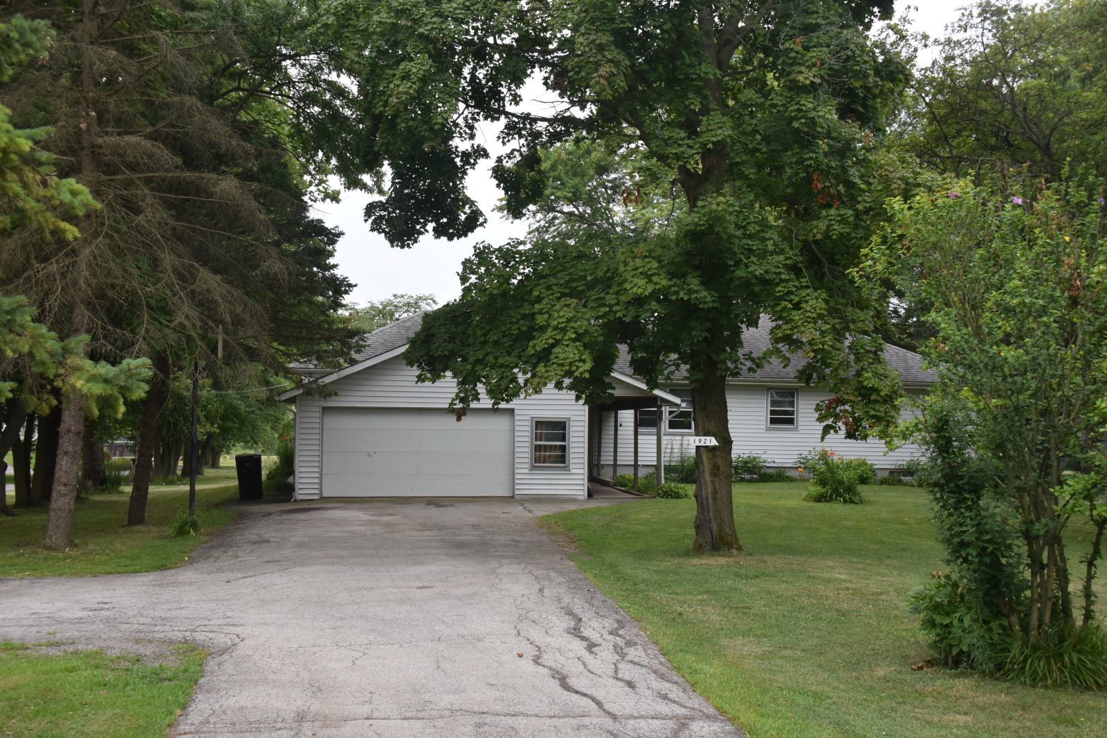 1921 East Steger Road Crete, IL 60417 - Photo 1 of 29 a front view of a house with garden