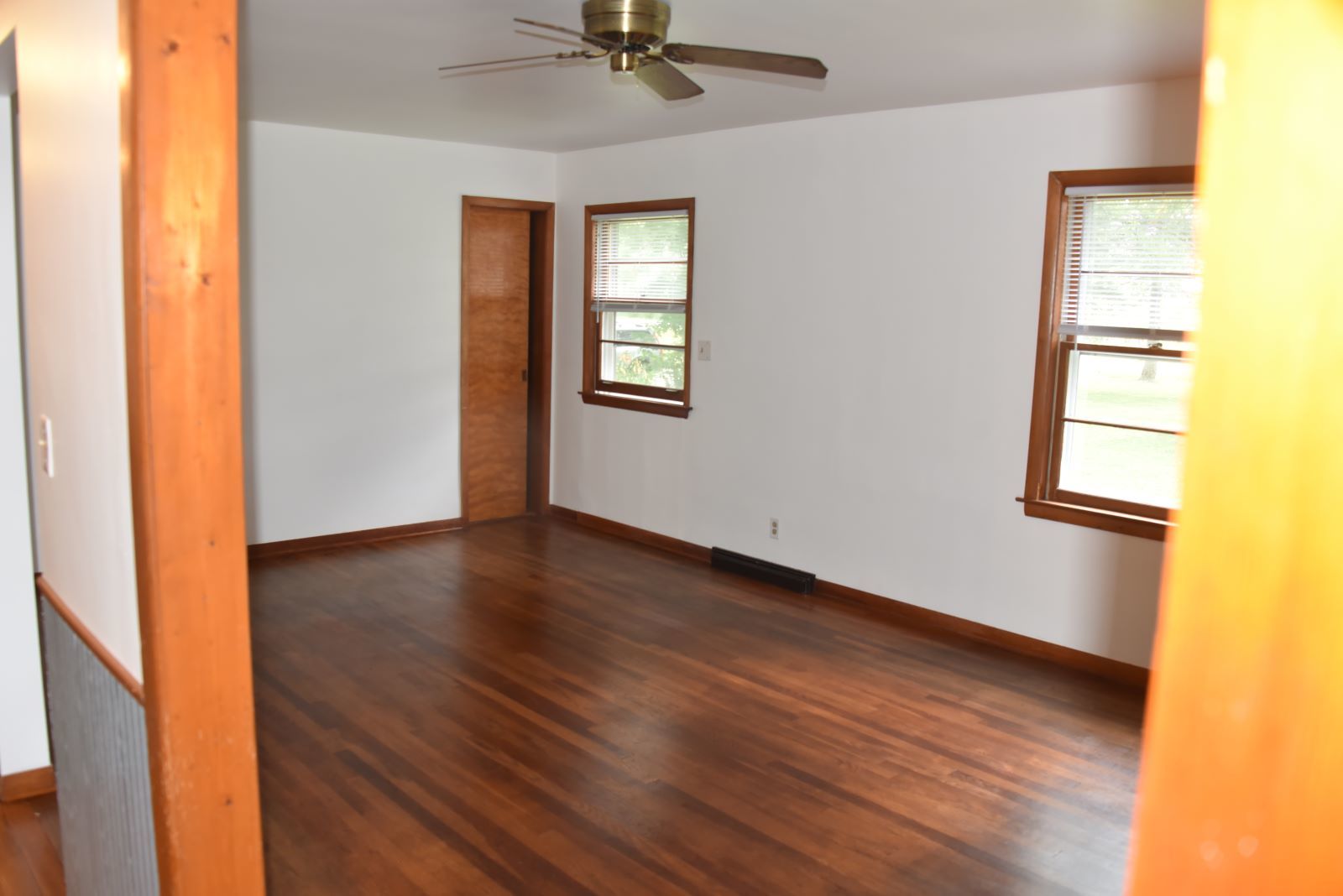 1921 East Steger Road Crete, IL 60417 - Photo 16 of 29 a view of an empty room with a window and wooden floor