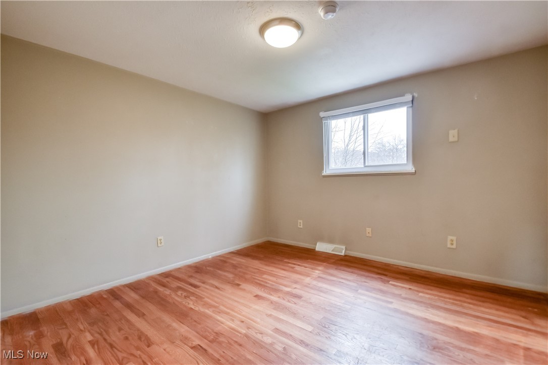 5618 Dolphin Road Mentor, OH 44060 - Photo 21 of 46 Spare room with light wood-style flooring and baseboards