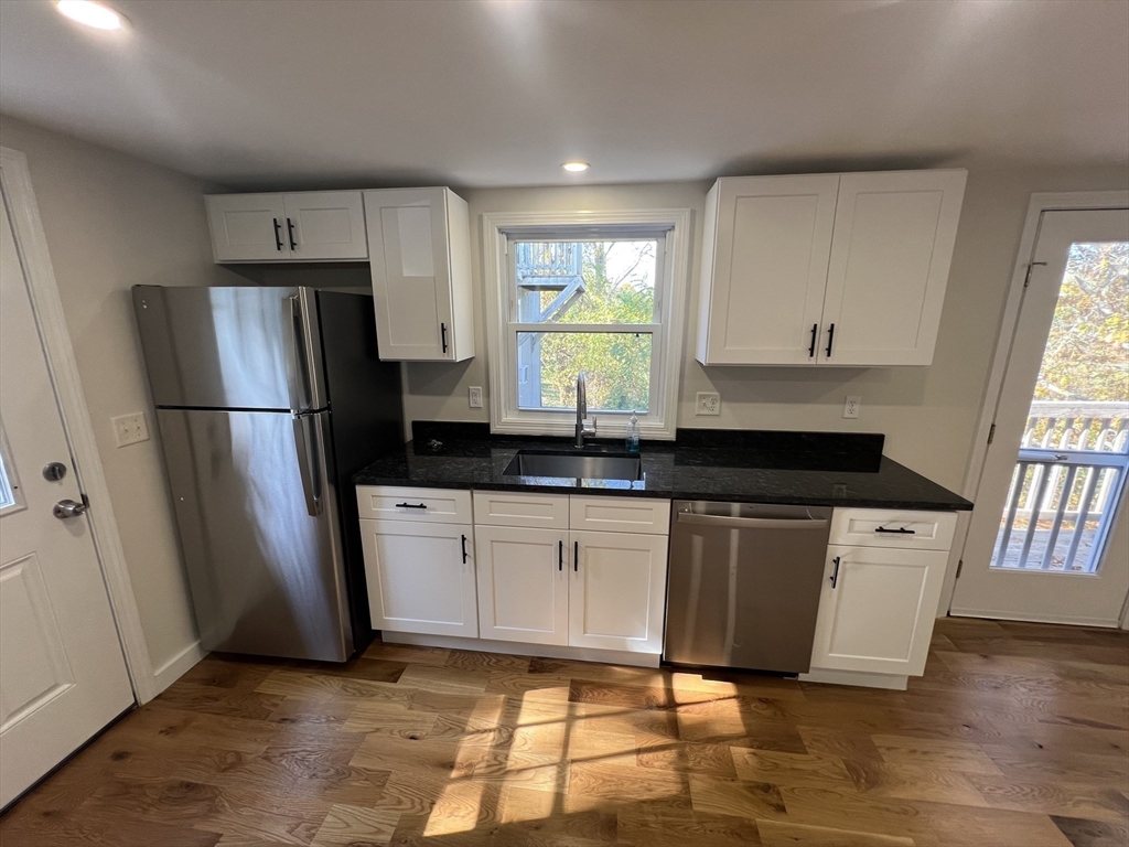 2705 State Highway Eastham, MA 02642 - Photo 17 of 42 a kitchen with stainless steel appliances a refrigerator sink and microwave