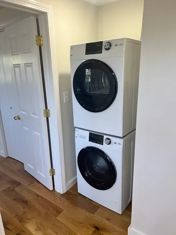 a view of a hallway with washer and dryer