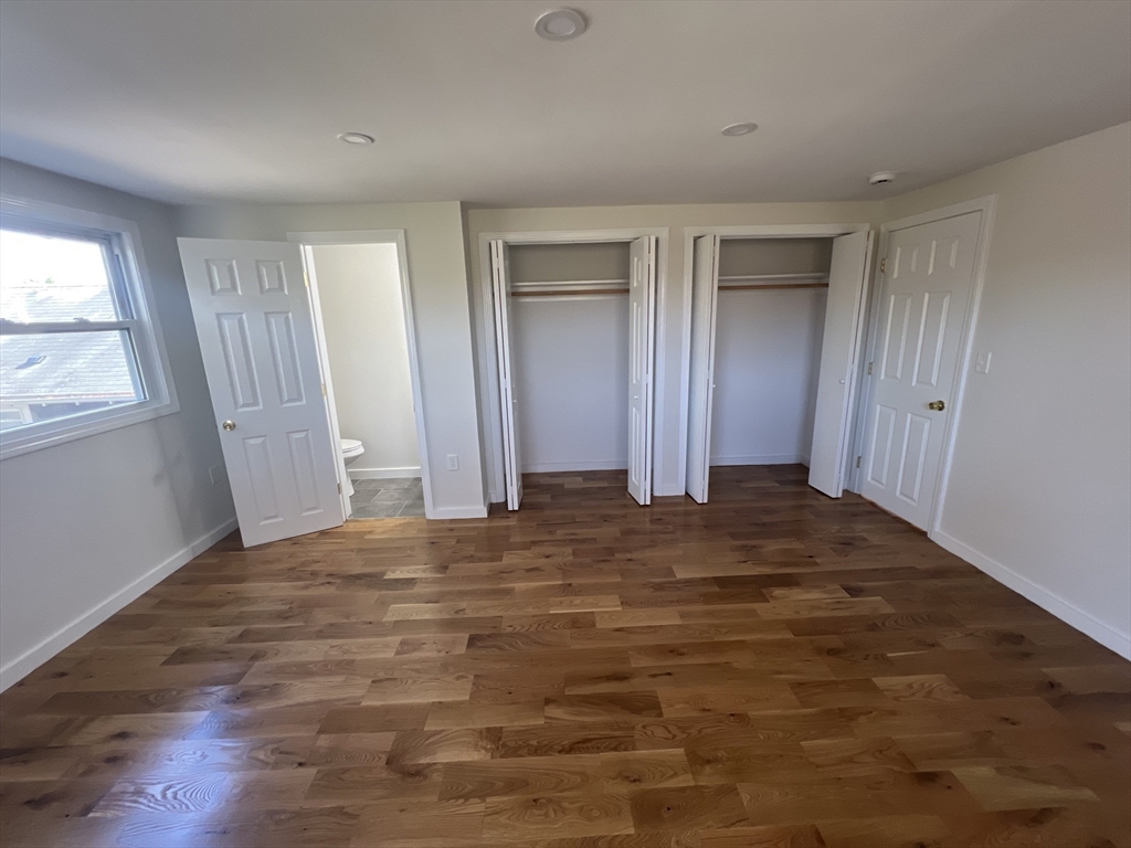 2705 State Highway Eastham, MA 02642 - Photo 24 of 42 a view of an empty room with wooden floor and a window