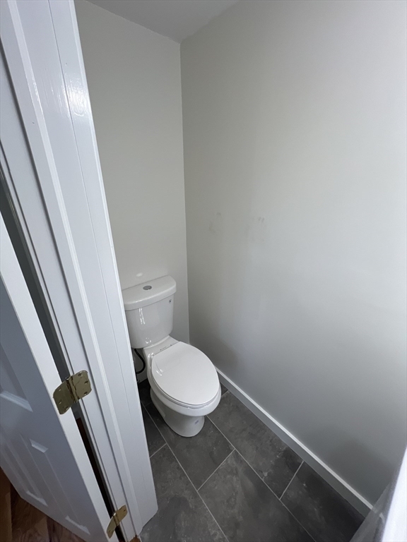 2705 State Highway Eastham, MA 02642 - Photo 25 of 42 a white toilet sitting next to a sink