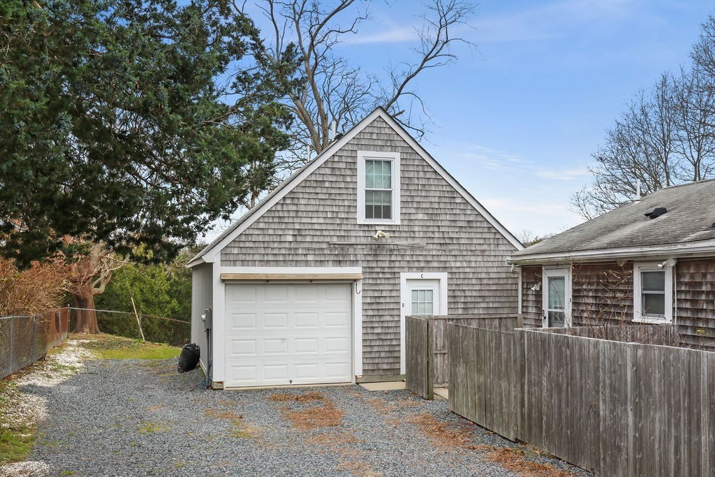 2705 State Highway Eastham, MA 02642 - Photo 27 of 42 a view of a house with a garage