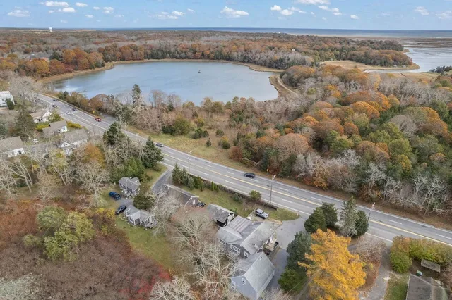 a view of a dry yard with wooden fence