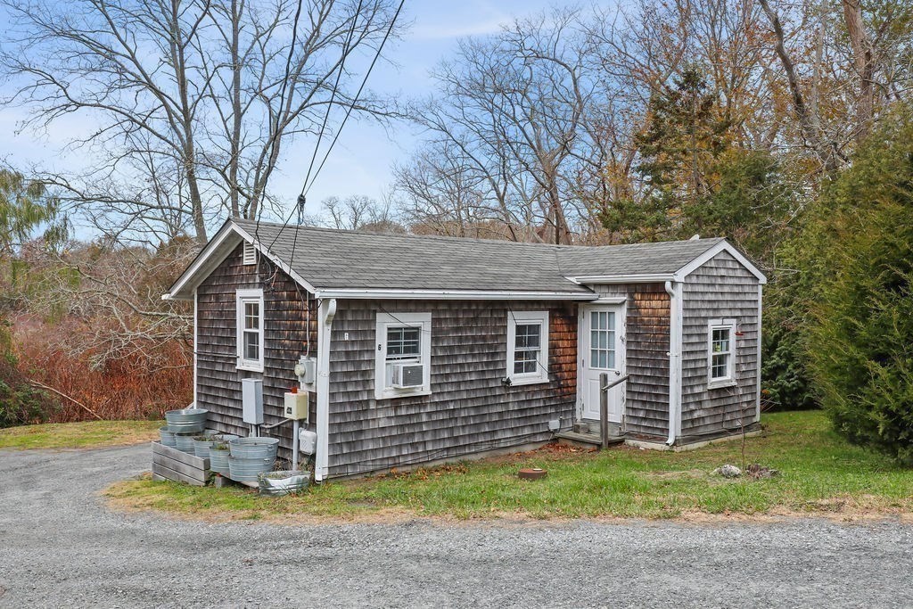 2705 State Highway Eastham, MA 02642 - Photo 36 of 42 a front view of a house with a garden