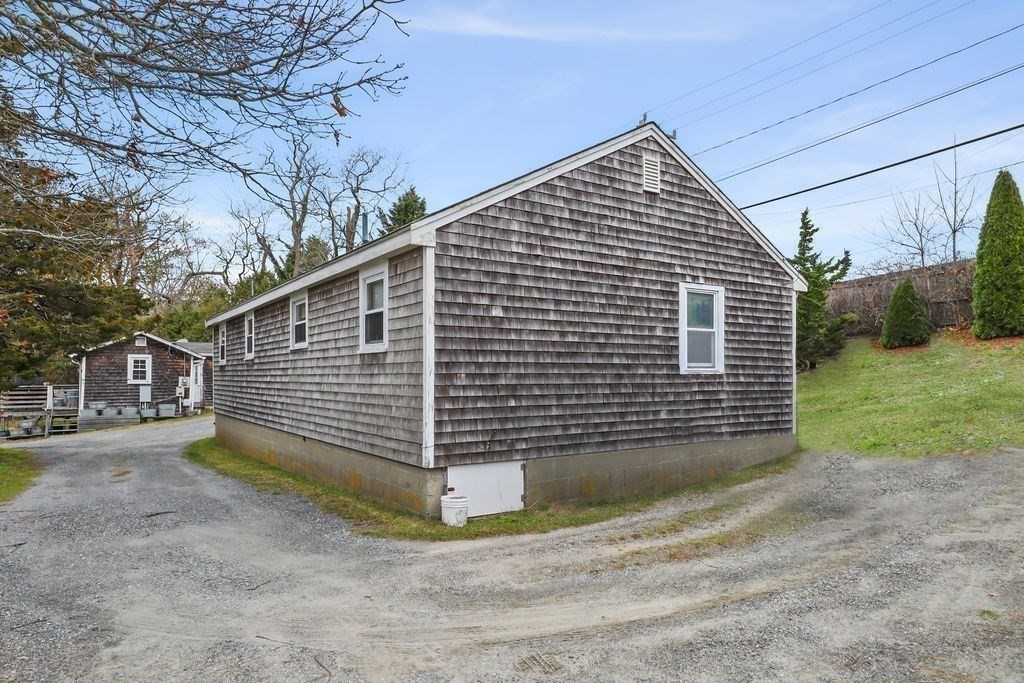 2705 State Highway Eastham, MA 02642 - Photo 41 of 42 a view of a house with a yard