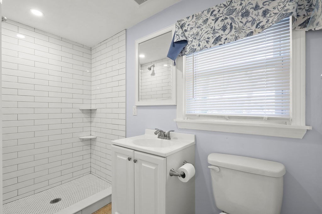 2705 State Highway Eastham, MA 02642 - Photo 9 of 42 a bathroom with a sink a toilet and shower