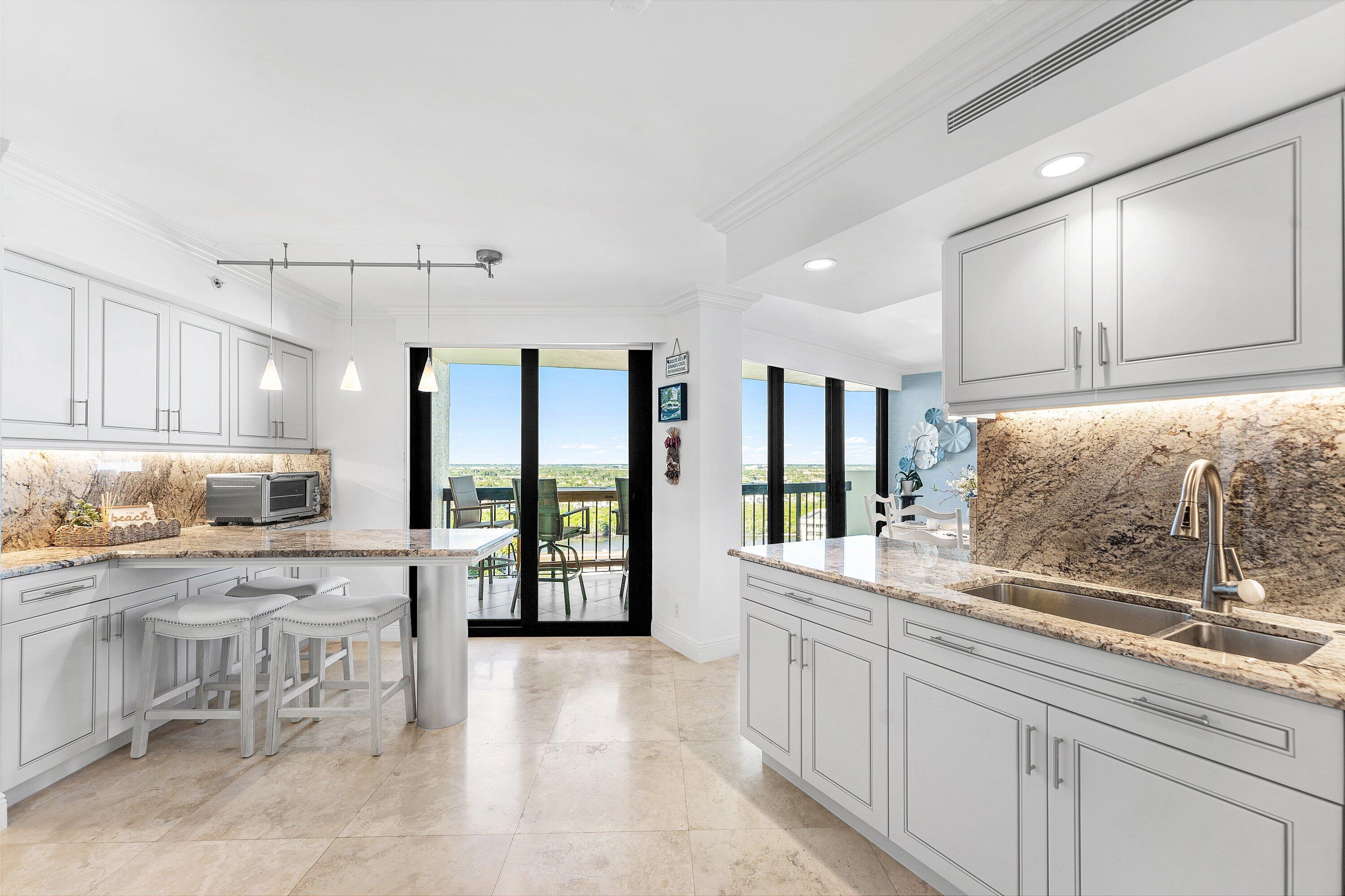 4545 North Ocean Boulevard, Unit PHD Boca Raton, FL 33431 - Photo 12 of 35 Kitchen w built in table, extra cabinets