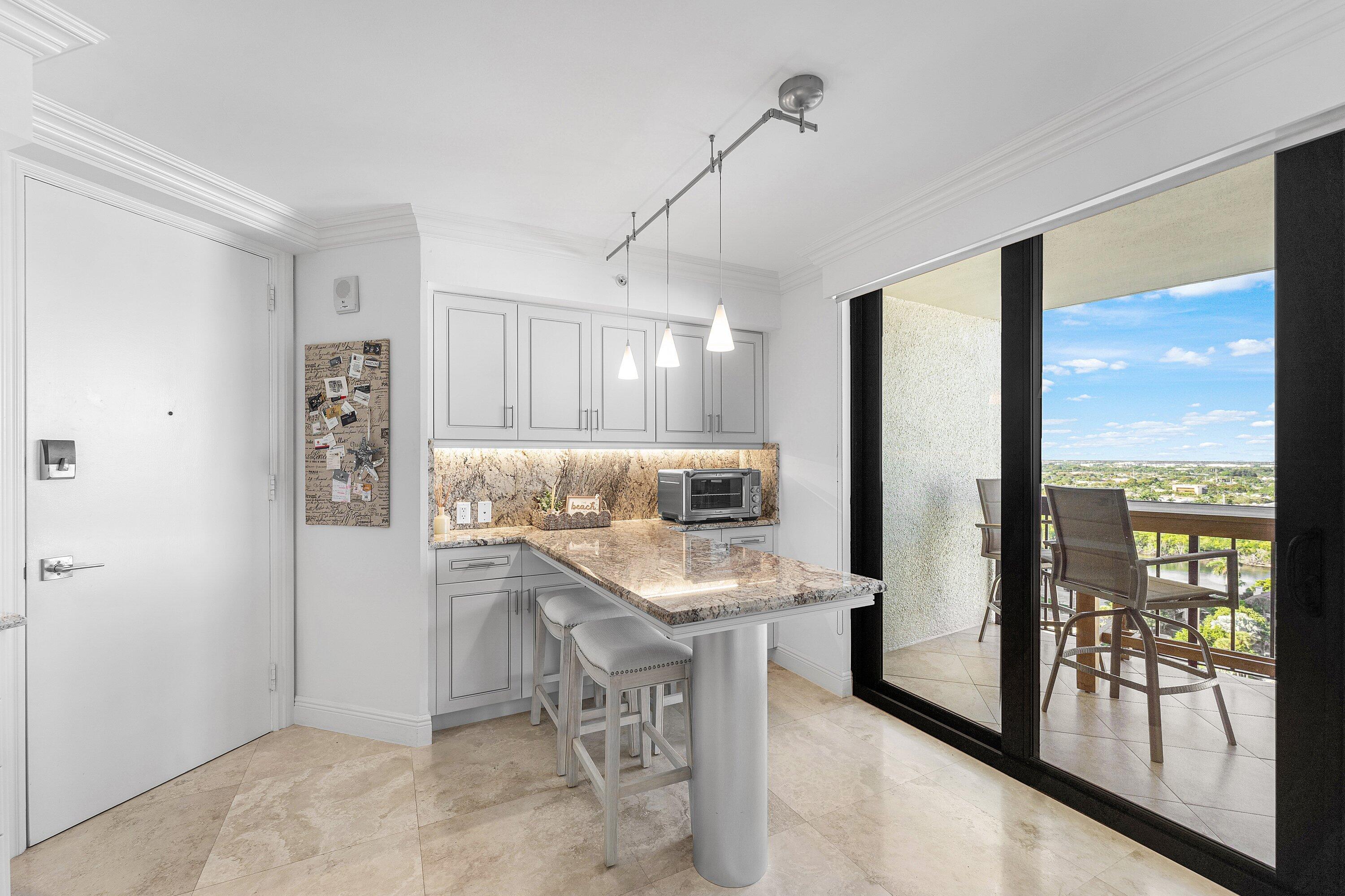 4545 North Ocean Boulevard, Unit PHD Boca Raton, FL 33431 - Photo 13 of 35 Built in kitchen table w extra cabinets