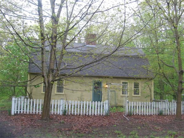26 Adams Road Boxford, MA 01921 - Photo 1 of 6 a view of a house with a small yard and wooden fence