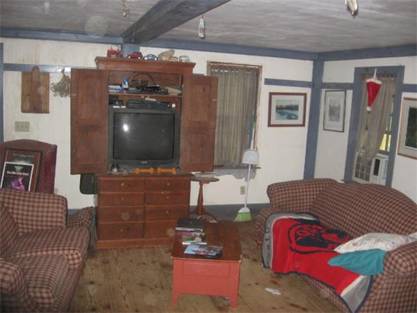26 Adams Road Boxford, MA 01921 - Photo 3 of 6 a living room with furniture and a flat screen tv