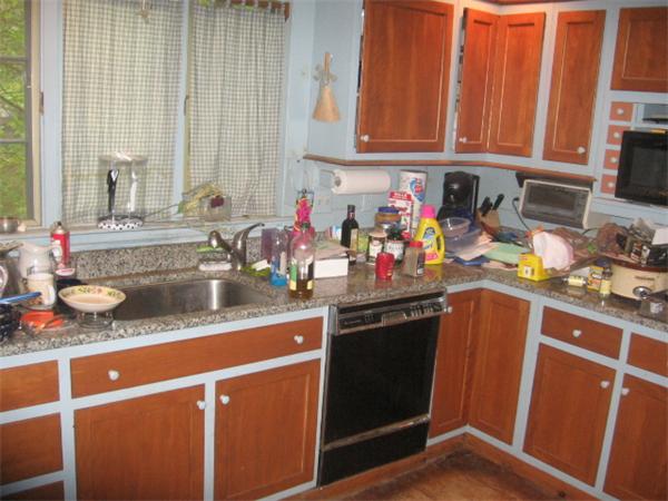 26 Adams Road Boxford, MA 01921 - Photo 4 of 6 a kitchen with stainless steel appliances granite countertop a sink stove and cabinets