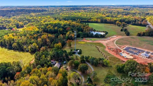 an aerial view of a house with a lake view