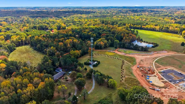 an aerial view of a house with a lake view
