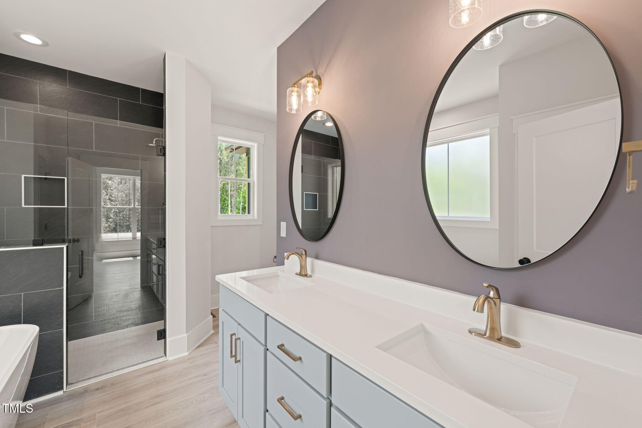 380 Pilot Ridge Road Zebulon, NC 27597 - Photo 23 of 42 a bathroom with a sink and a mirror