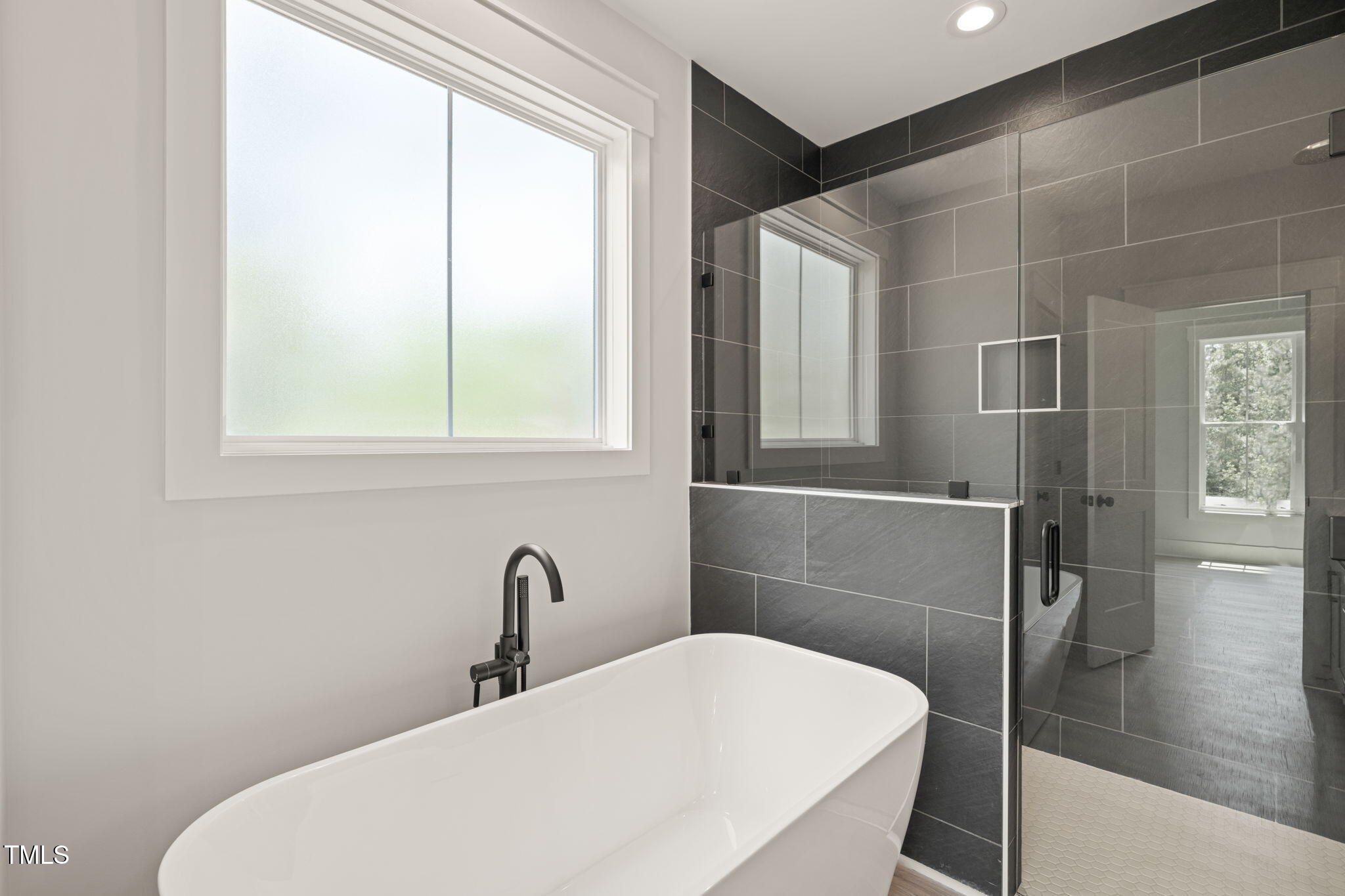 380 Pilot Ridge Road Zebulon, NC 27597 - Photo 24 of 42 a bathroom with a sink and a mirror