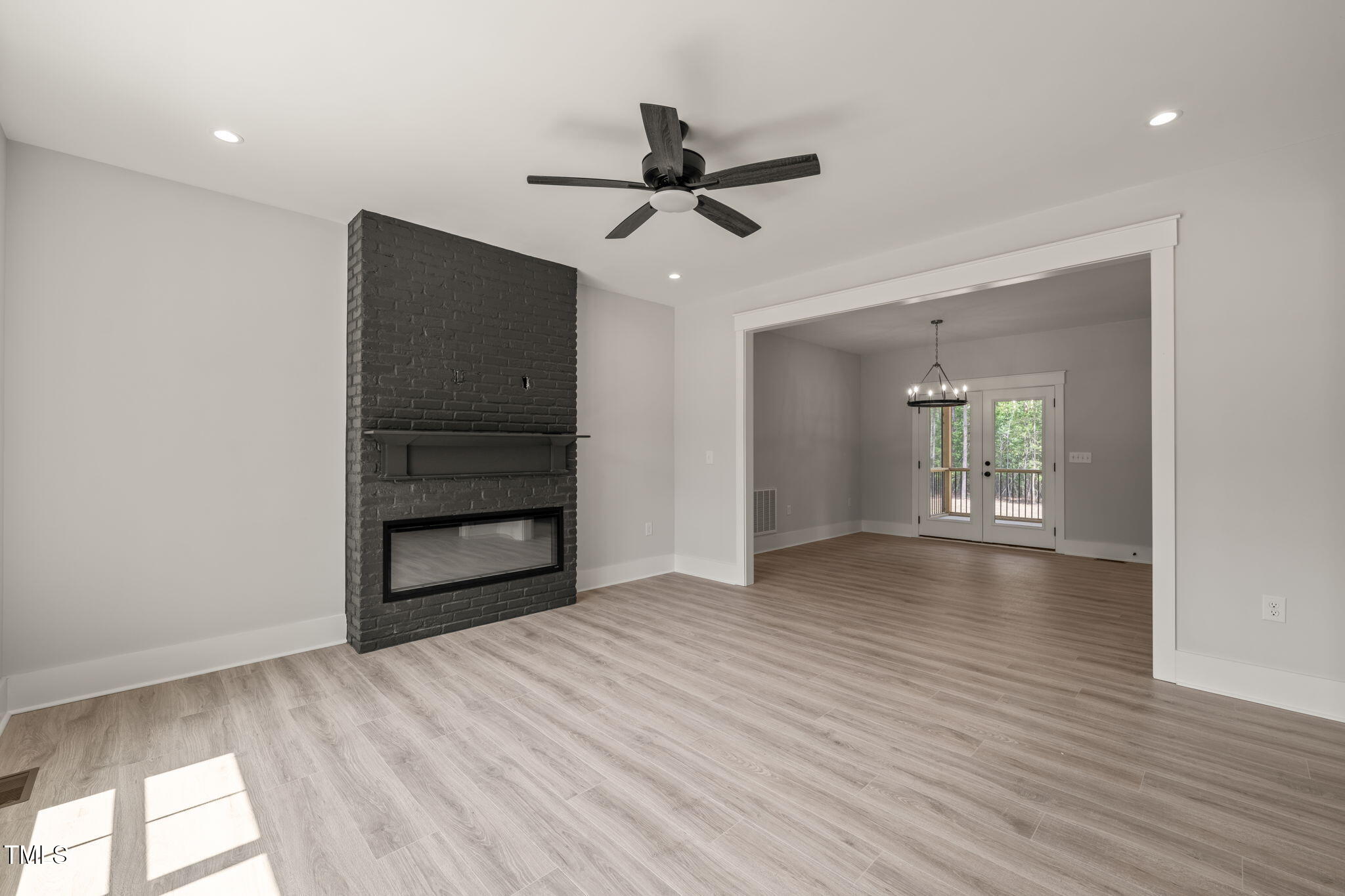 380 Pilot Ridge Road Zebulon, NC 27597 - Photo 5 of 42 a view of empty room with wooden floor and window
