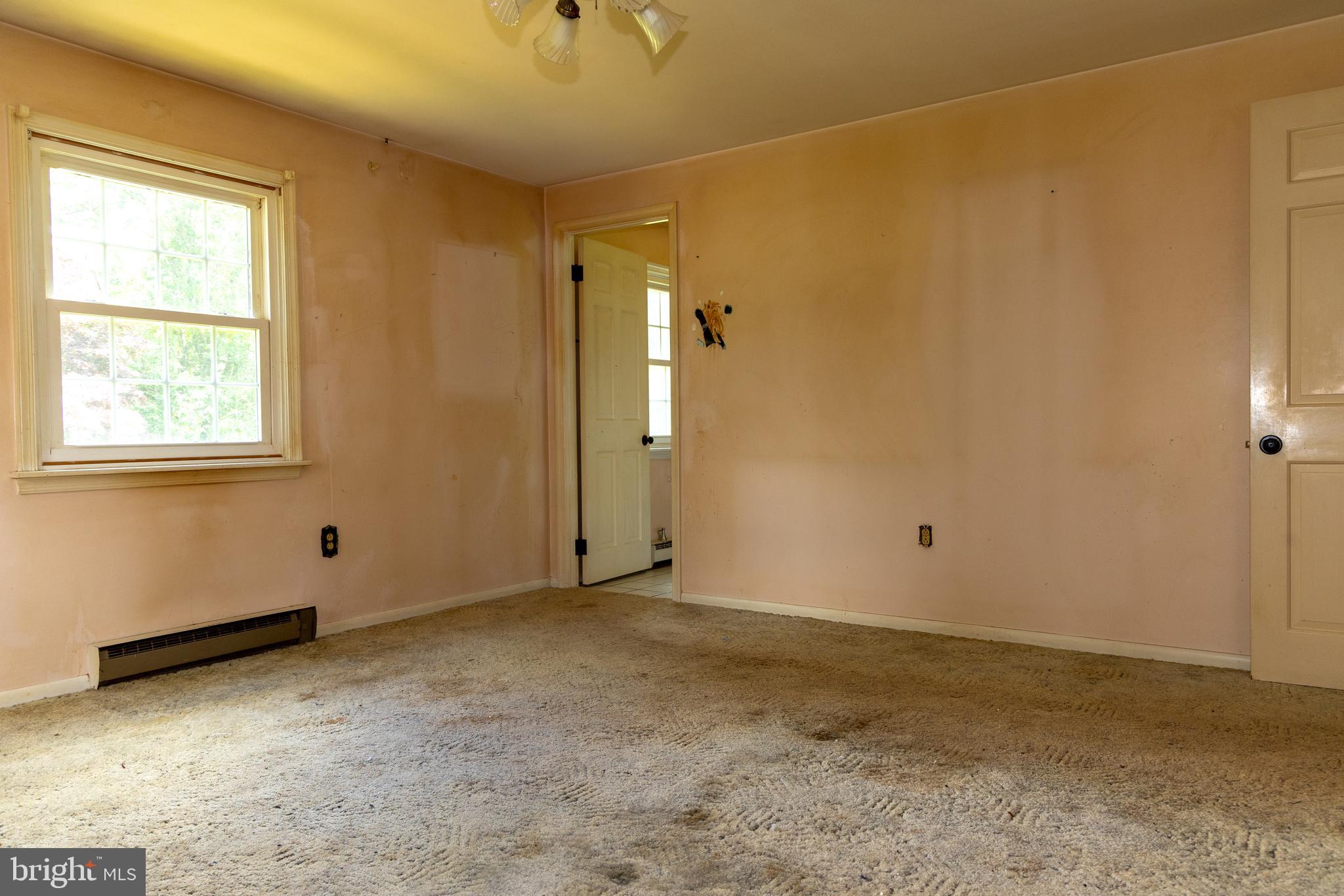 1929 Hillendale Road Chadds Ford, PA 19317 - Photo 36 of 56 a view of an empty room with window and chandelier fan