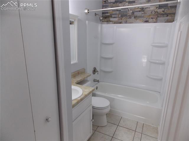 6375 Bismark Road Colorado Springs, CO 80922 - Photo 14 of 24 Upper level bathroom includes a large linen closet.