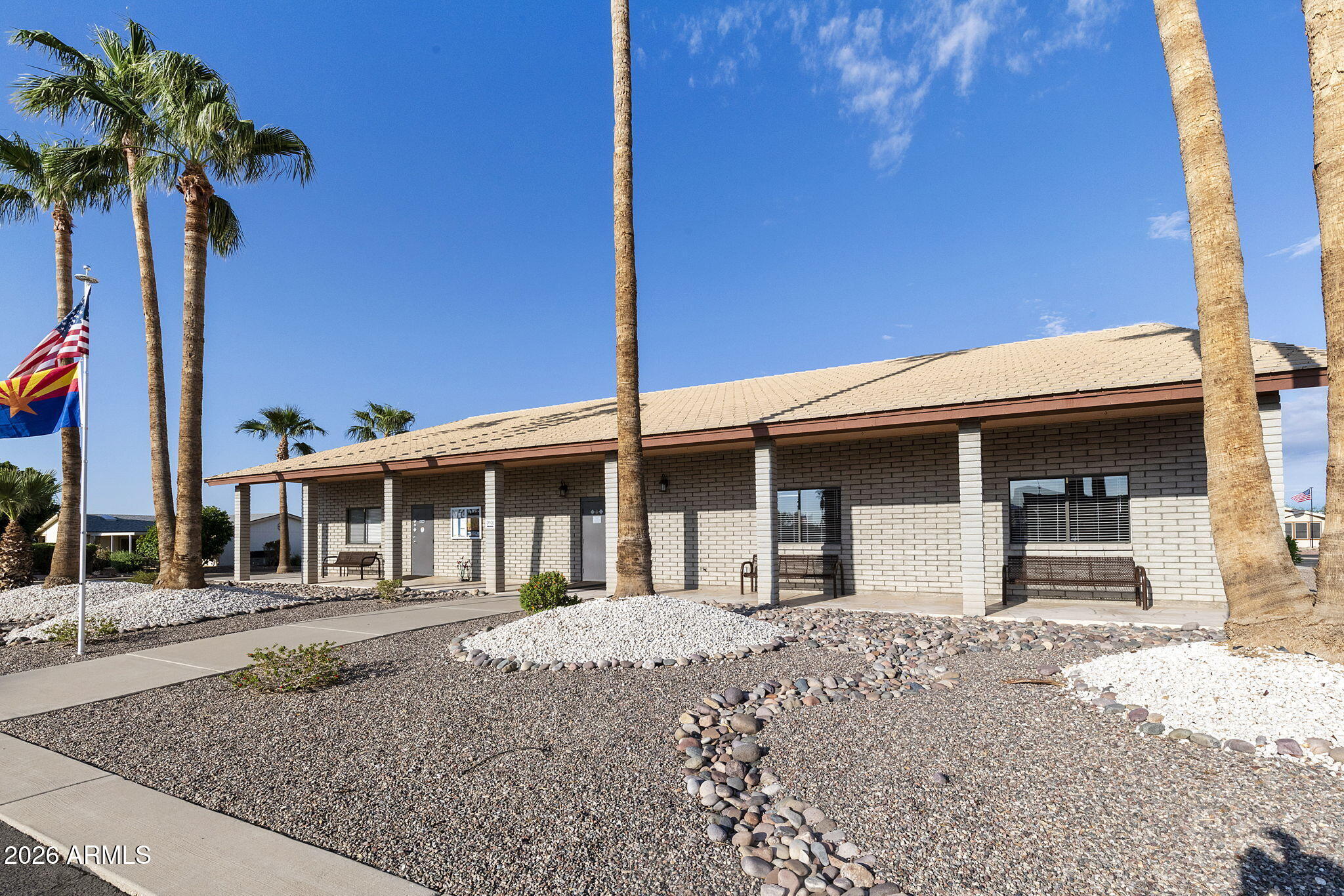 3700 South Tomahawk Road, Unit 73 Apache Junction, AZ 85119 - Photo 38 of 49 a front view of a house with garden