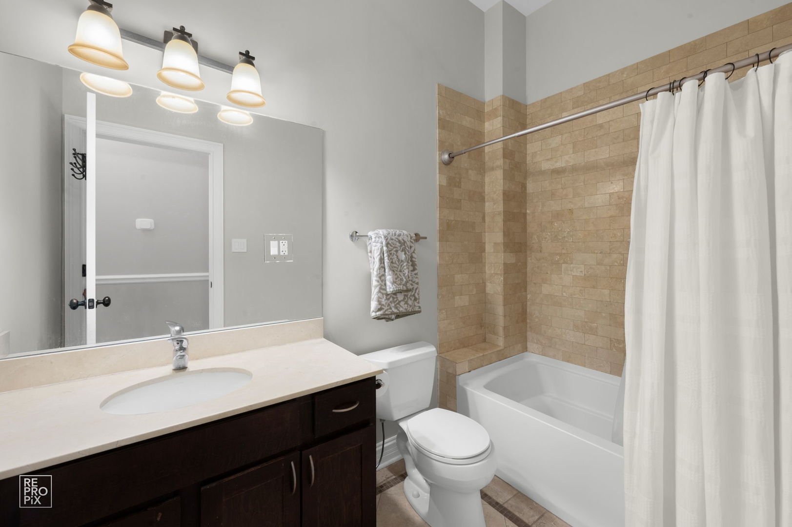 1526 West Monroe Street, Unit PH3 Chicago, IL 60607 - Photo 16 of 19 a bathroom with a sink a toilet a mirror and shower