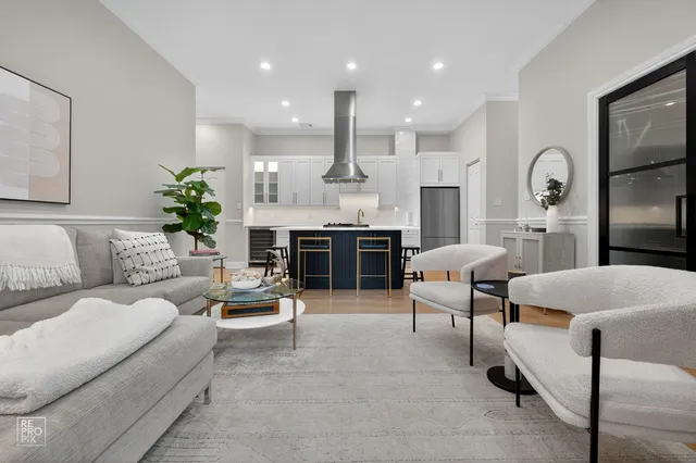 a living room with furniture fireplace and window