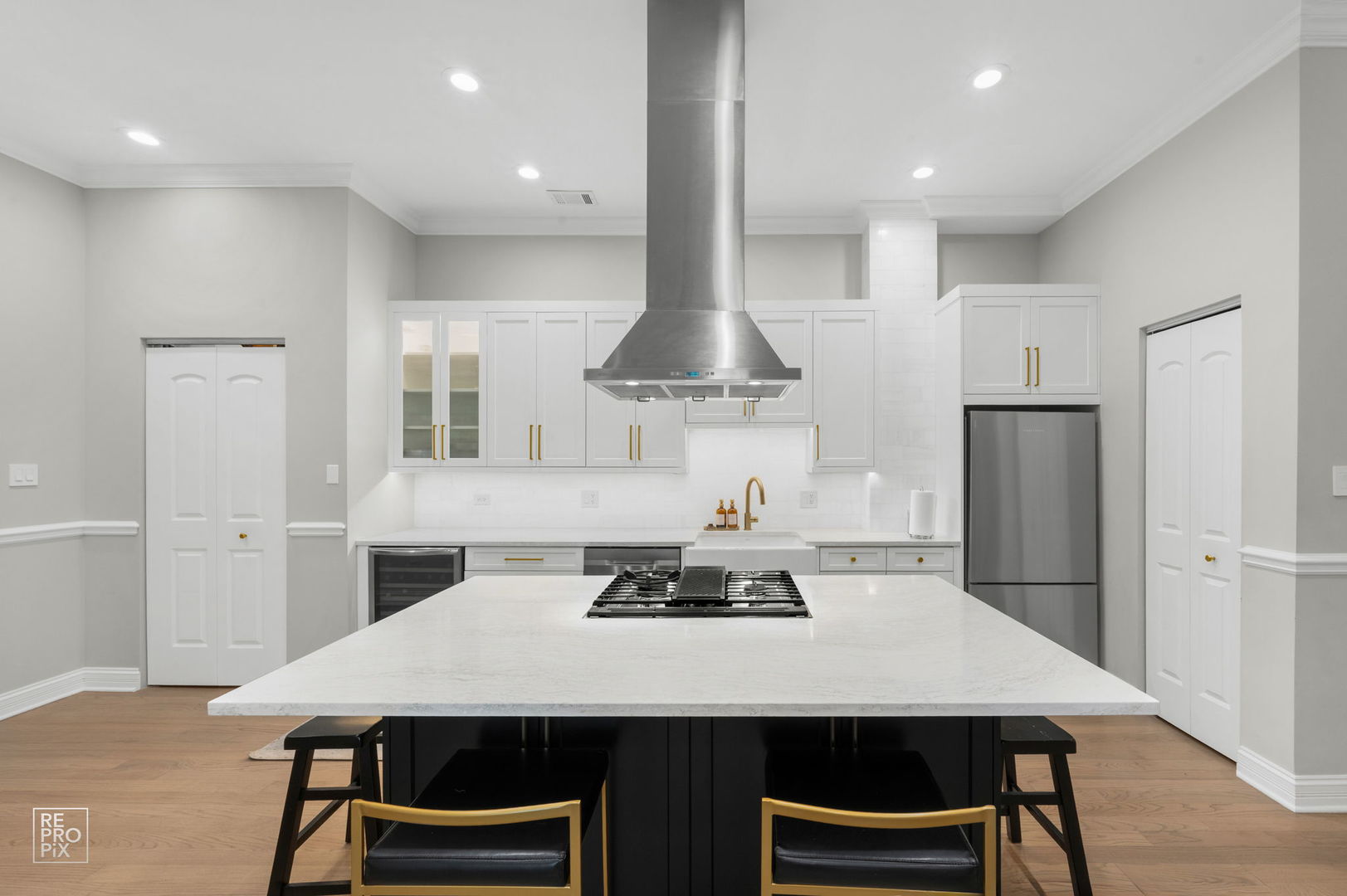 1526 West Monroe Street, Unit PH3 Chicago, IL 60607 - Photo 6 of 19 a kitchen with stainless steel appliances a table chairs and refrigerator
