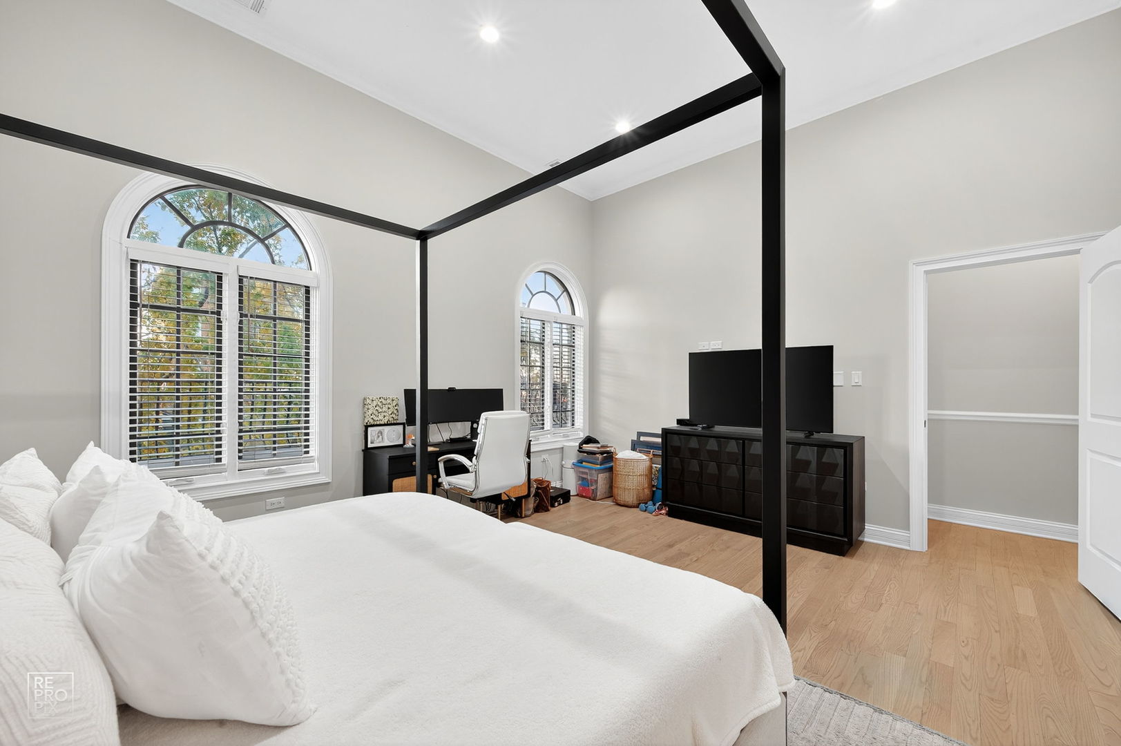 1526 West Monroe Street, Unit PH3 Chicago, IL 60607 - Photo 7 of 19 a bedroom with a bed window and a flat tv screen