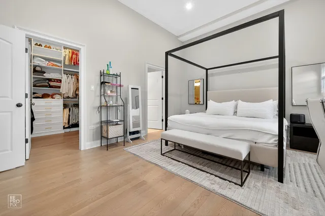 a bedroom with a bed and a cabinets