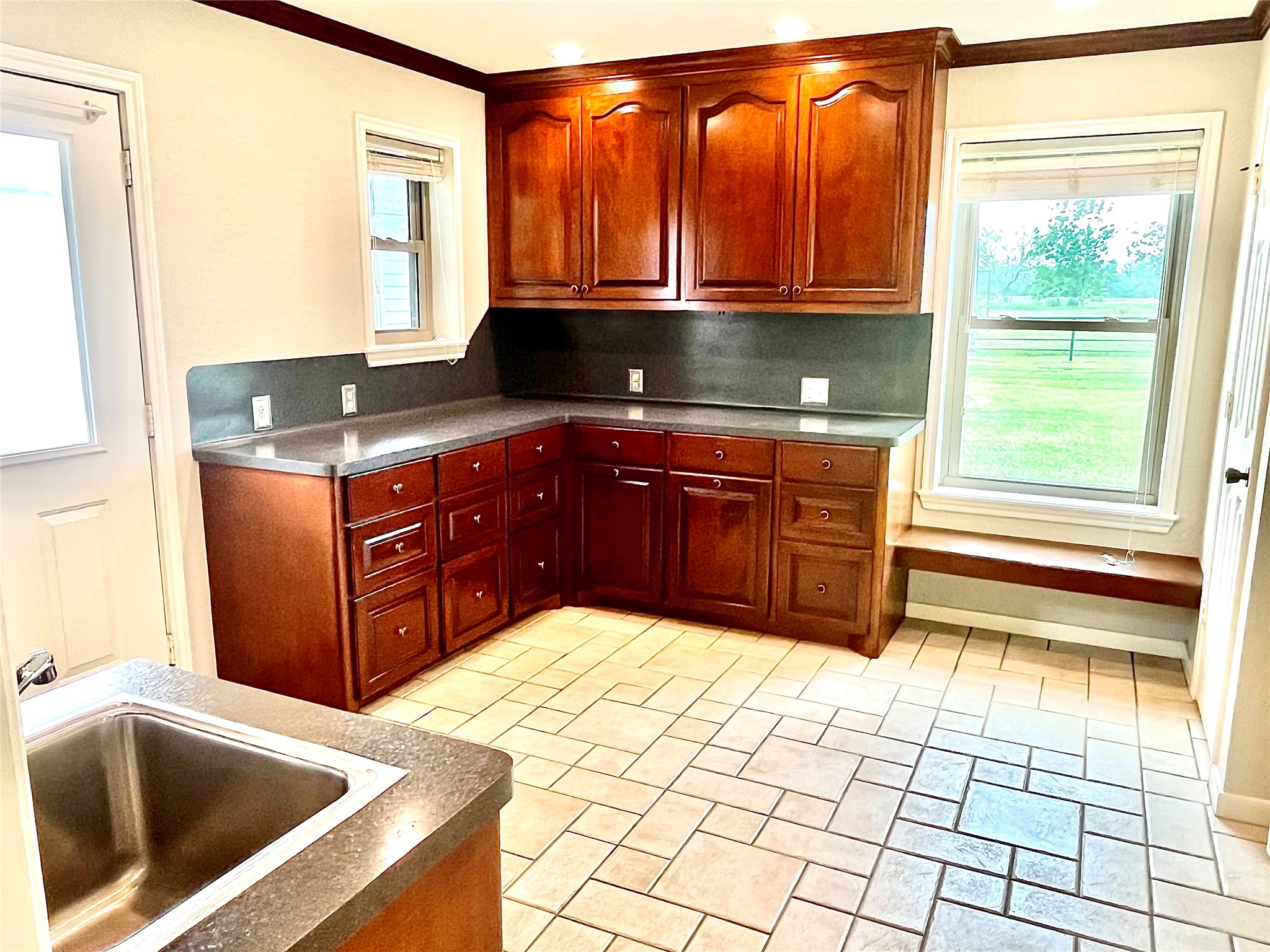 37243 FM 521 Road Bay City, TX 77414 - Photo 26 of 50 Large 14'x11' utility room with more storage space and beautiful cabinetry.