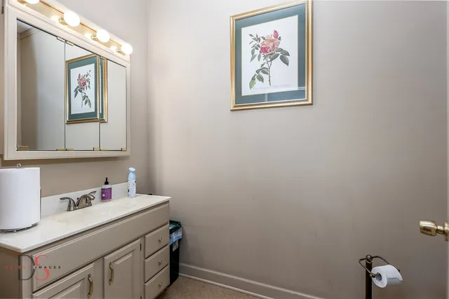 a bathroom with a sink and a mirror