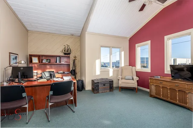 a work room with furniture and windows