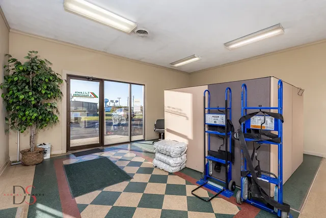 a living room with furniture and a book shelf