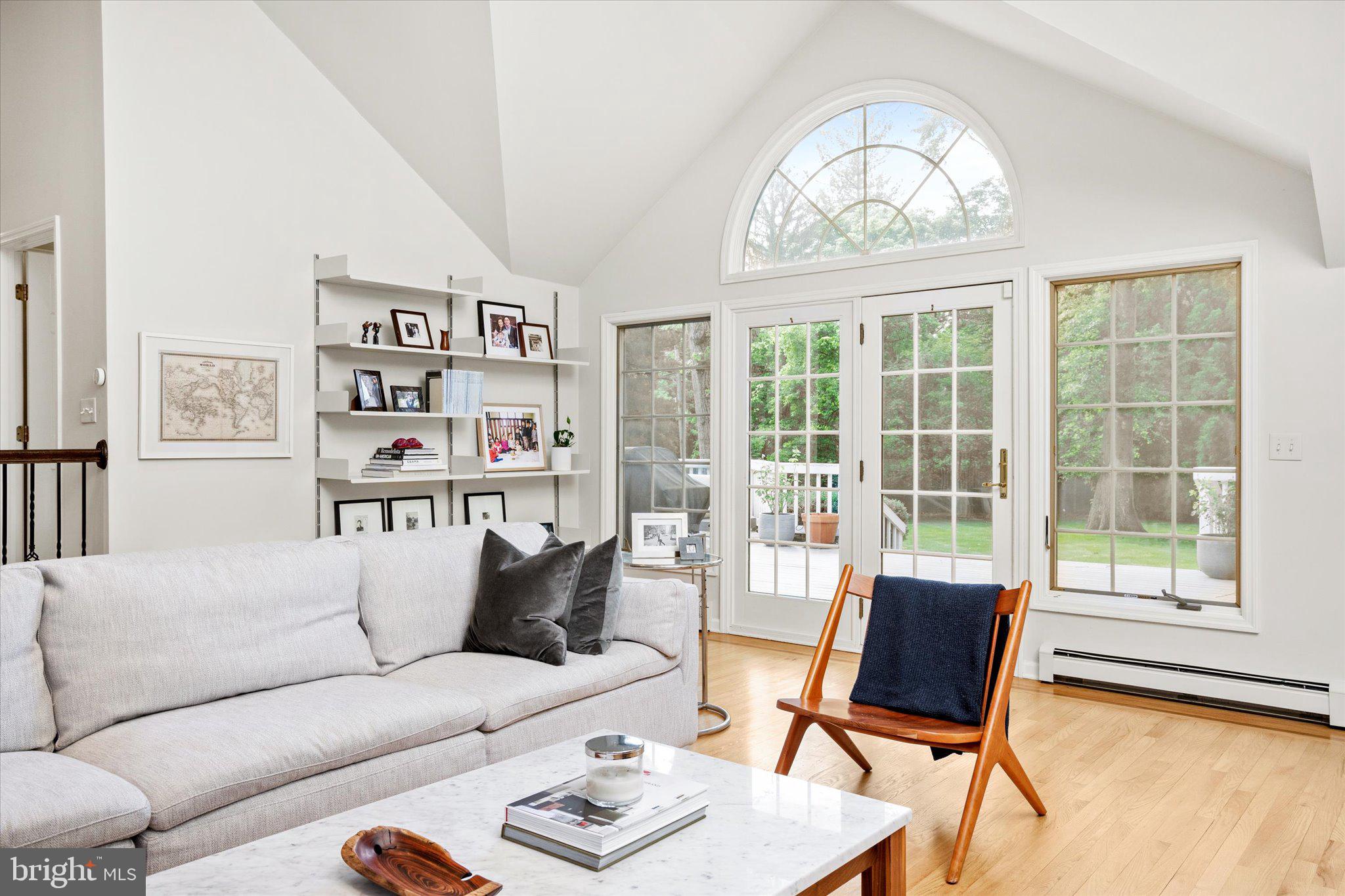 127 Westerly Road Princeton, NJ 08540 - Photo 11 of 30 a living room with furniture a bookshelf and a large window
