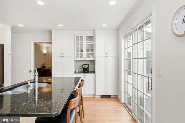 a view of a kitchen with furniture and a window