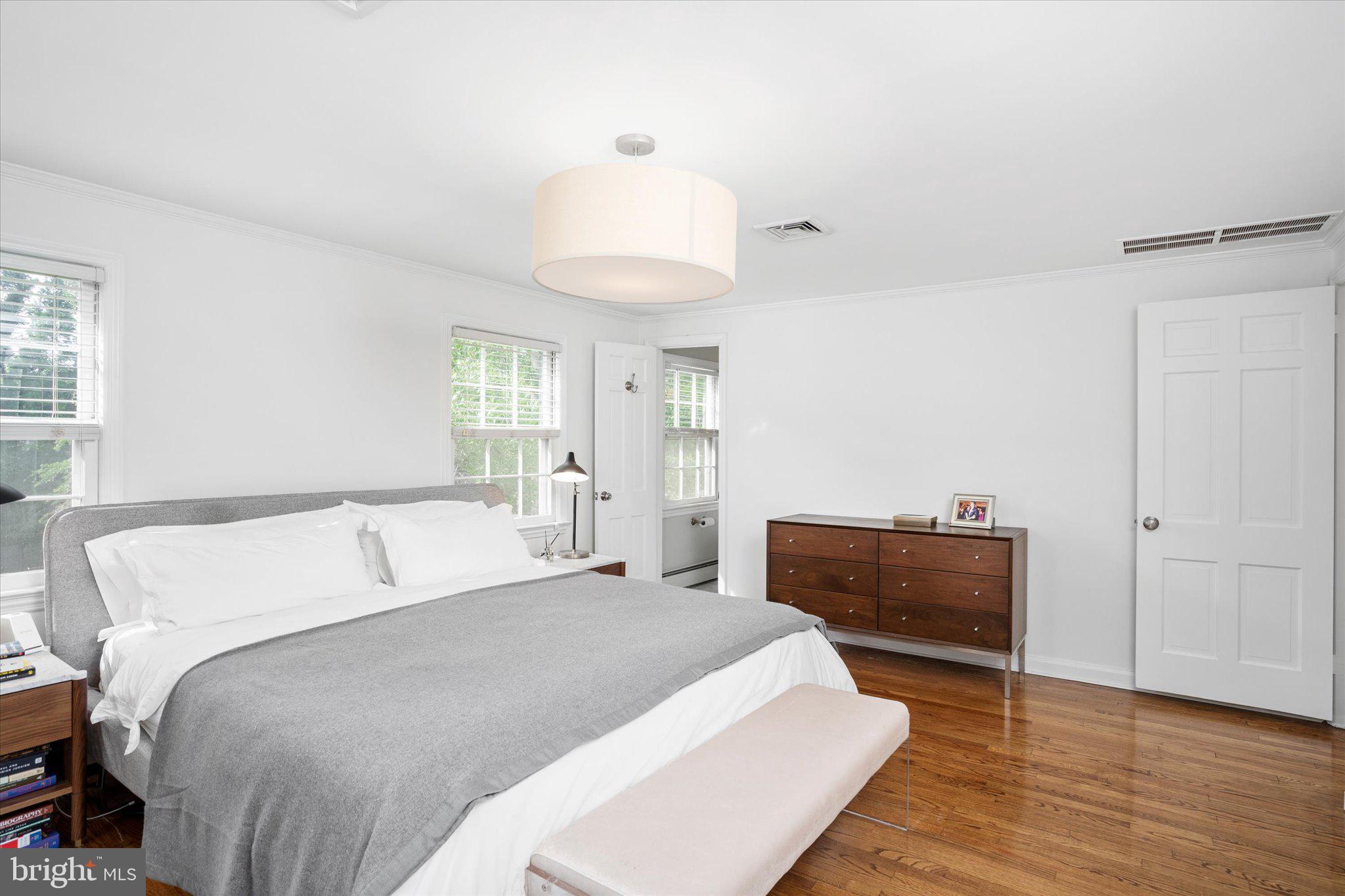 127 Westerly Road Princeton, NJ 08540 - Photo 18 of 30 a bedroom with a bed and wooden floor