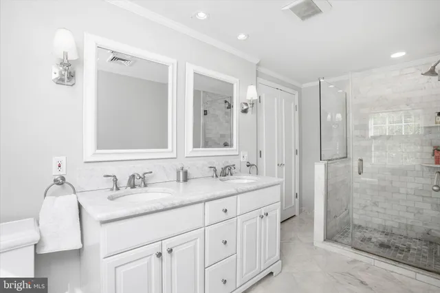 a bathroom with a granite countertop sink mirror and double