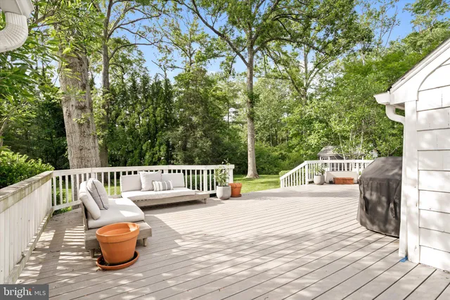 a view of balcony with two chairs and wooden floor