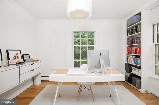 a view of a workspace with furniture
