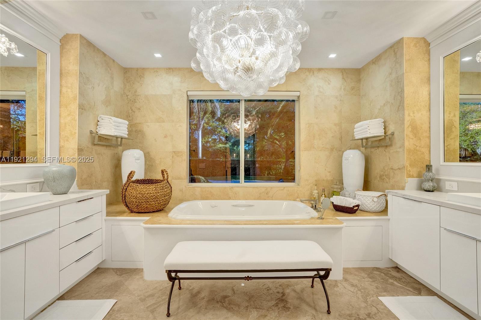 10400 Southwest 62nd Street Miami, FL 33173 - Photo 12 of 34 a living room with a window and a chandelier