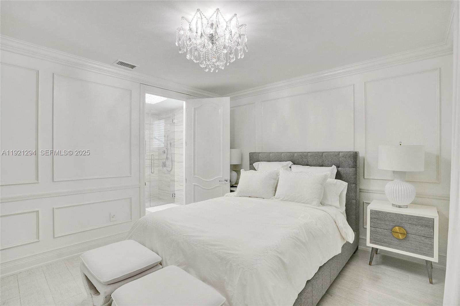 10400 Southwest 62nd Street Miami, FL 33173 - Photo 13 of 34 a bedroom with a bed and a chandelier